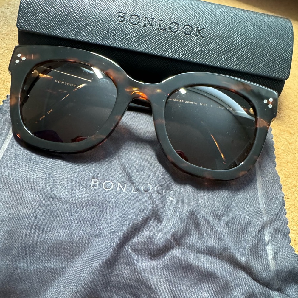 Tortoise shell frame designer sunglasses.